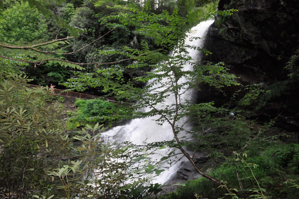 people on the two tiers of path and stairs leading to the falls.